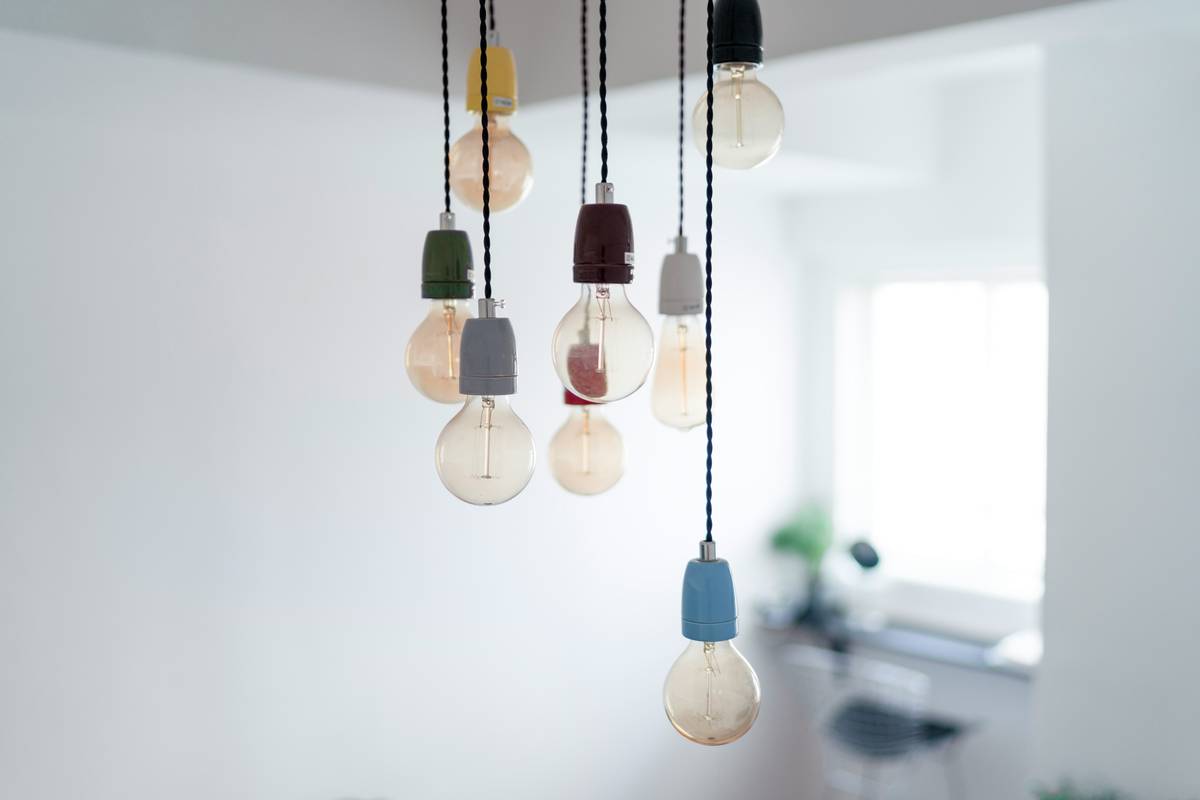Diagram showing correct bar pendant lighting height: 30-36 inches above countertop, with sightline clearance and even spacing for 2-3 fixtures